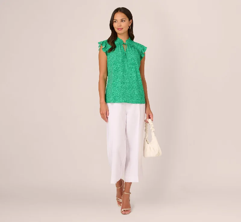 printed-flutter-sleeve-top-with-tie-neck-in-emerald-ivory-micro-dot-ad1s301640